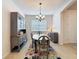 Formal dining room with a decorative rug, a chandelier, and plenty of space at 14655 Potterton Cir, Hudson, FL 34667