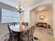 Formal dining area with chandelier and view into front entry hall at 14655 Potterton Cir, Hudson, FL 34667