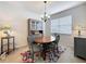 Cozy dining space with a four-chair dining set and china cabinet at 14655 Potterton Cir, Hudson, FL 34667