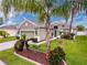 Charming single-story home with a well-manicured lawn, lush landscaping and a two car garage at 14655 Potterton Cir, Hudson, FL 34667