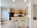 Galley style kitchen featuring wooden cabinets and breakfast bar seating at 14655 Potterton Cir, Hudson, FL 34667