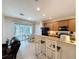 Eat-in kitchen featuring granite countertops, stainless steel appliances, and a breakfast bar at 14655 Potterton Cir, Hudson, FL 34667
