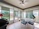 Relaxing sun room with ample natural light and outdoor views, perfect for dining or lounging at 14655 Potterton Cir, Hudson, FL 34667