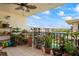 Balcony offers tile flooring, ceiling fan, and a tranquil view of water and buildings at 19531 Gulf Blvd # 611, Indian Shores, FL 33785