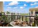 Balcony view shows shells on table with lovely view of water and buildings at 19531 Gulf Blvd # 611, Indian Shores, FL 33785