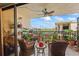 Outdoor balcony featuring tile floor, ceiling fan, overlooking view of water at 19531 Gulf Blvd # 611, Indian Shores, FL 33785