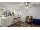 Bright dining area featuring a kitchen view, granite counters, modern lighting, and a ceiling fan at 19531 Gulf Blvd # 611, Indian Shores, FL 33785