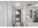 Bright condo foyer with a view to the outside and a laundry closet at 19531 Gulf Blvd # 611, Indian Shores, FL 33785