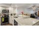 Well-lit kitchen with granite countertops, stainless steel appliances, and a functional layout at 19531 Gulf Blvd # 611, Indian Shores, FL 33785