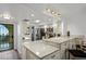 Stylish kitchen featuring granite countertops, stainless steel appliances, and access to a balcony at 19531 Gulf Blvd # 611, Indian Shores, FL 33785