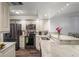 Bright kitchen with granite counters, stainless appliances, and decorative backsplash for a modern look at 19531 Gulf Blvd # 611, Indian Shores, FL 33785
