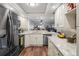 Modern kitchen with stainless steel appliances, granite countertops, and mosaic tile backsplash at 19531 Gulf Blvd # 611, Indian Shores, FL 33785