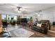 Living room with mirrored wall reflecting views of the balcony at 19531 Gulf Blvd # 611, Indian Shores, FL 33785