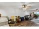 Open living room with modern floors, comfortable seating, and a sliding door leading to an outdoor balcony at 19531 Gulf Blvd # 611, Indian Shores, FL 33785