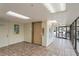 The lobby has a clean lobby area with brick tile floor, artwork, elevator access and glass doors with a view to the entrance at 19531 Gulf Blvd # 611, Indian Shores, FL 33785