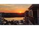 Balcony view of the water showcasing boats, palm trees and the sunset at 19531 Gulf Blvd # 611, Indian Shores, FL 33785