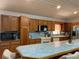Spacious kitchen with ample counter space, tile backsplash, and stainless steel appliances at 20971 Negril Ct, Lutz, FL 33558