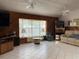 Large living room with a cozy window seat and neutral color scheme, perfect for relaxation at 20971 Negril Ct, Lutz, FL 33558