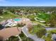 Scenic aerial view of community clubhouse with pool, golf course, and meticulously landscaped grounds at 2183 Westchester Blvd, Spring Hill, FL 34606