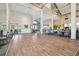 Expansive ballroom with hardwood floors, soaring ceilings, and elegant chandeliers at 2183 Westchester Blvd, Spring Hill, FL 34606