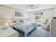 The primary bedroom has carpeted floors, white walls and trim, and a ceiling fan at 2183 Westchester Blvd, Spring Hill, FL 34606