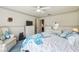 Comfortable bedroom boasts carpeted floors, ceiling fan, and an open closet at 2183 Westchester Blvd, Spring Hill, FL 34606
