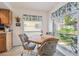 Sunny dining area with large windows, breakfast nook, and lovely backyard views at 2183 Westchester Blvd, Spring Hill, FL 34606