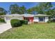 Charming one-story home with a well-manicured lawn and cozy front porch at 2183 Westchester Blvd, Spring Hill, FL 34606