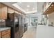 Bright kitchen with stainless steel appliances, wood cabinets, and a breakfast nook at 2183 Westchester Blvd, Spring Hill, FL 34606