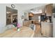Open kitchen layout with wooden cabinets, a breakfast bar, and adjacent dining area at 2183 Westchester Blvd, Spring Hill, FL 34606