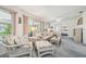 Cozy living room with wicker furniture and a view into the primary bedroom at 2183 Westchester Blvd, Spring Hill, FL 34606