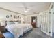 Comfortable main bedroom with large bed, dresser, soft lighting, and closet at 2183 Westchester Blvd, Spring Hill, FL 34606