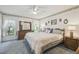 Comfortable main bedroom with large bed, dresser, soft lighting, and carpet at 2183 Westchester Blvd, Spring Hill, FL 34606