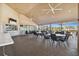 Covered outdoor seating area with tables and chairs, perfect for al fresco dining and socializing at 2183 Westchester Blvd, Spring Hill, FL 34606