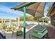 Inviting pool area with lounge chairs, umbrellas, and well-maintained landscaping, ideal for relaxation at 2183 Westchester Blvd, Spring Hill, FL 34606