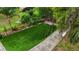 This backyard features an artificial turf lawn and soccer goal for year-round recreation and enjoyment at 2202 Amity Ct, New Port Richey, FL 34655