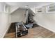 Basement gym with wood floors, workout equipment, and natural light at 2202 Amity Ct, New Port Richey, FL 34655