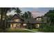 Charming two-story home featuring a balcony, mature landscaping, and inviting curb appeal at 2202 Amity Ct, New Port Richey, FL 34655