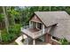 Exterior angled shot of a two-story house highlighting the balcony and surrounding greenery at 2202 Amity Ct, New Port Richey, FL 34655