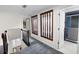 Hallway with decorative wood panels and railing that looks down on the entry way at 2202 Amity Ct, New Port Richey, FL 34655