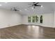 Bright living room with vaulted ceiling, ceiling fans, and bay windows at 2202 Amity Ct, New Port Richey, FL 34655