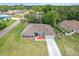 Aerial shot of a single Gathering home with well-maintained landscaping and a spacious front yard at 2251 Evenglow Ave, Spring Hill, FL 34609