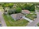 This is an aerial shot of a single Gathering home with a large front yard and driveway at 2251 Evenglow Ave, Spring Hill, FL 34609