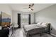 Bedroom with ceiling fan, wooden floors, and natural light at 2251 Evenglow Ave, Spring Hill, FL 34609