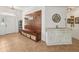 Inviting entryway with custom wood bench, storage, tiled flooring, and painted accents, adding unique charm at 2251 Evenglow Ave, Spring Hill, FL 34609