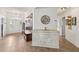 Inviting entryway with custom bench and storage, tiled flooring, and white-painted accents, offering style and functionality at 2251 Evenglow Ave, Spring Hill, FL 34609