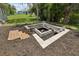 Newly installed backyard fire pit with modern seating, offering a perfect blend of comfort and style for outdoor entertainment at 2251 Evenglow Ave, Spring Hill, FL 34609