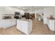 Open-concept kitchen featuring an island, stainless steel appliances, and easy access to the dining area at 2251 Evenglow Ave, Spring Hill, FL 34609