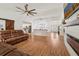 Open-concept living space with modern decor, fireplace feature, and ample seating, perfect for Gathering gatherings at 2251 Evenglow Ave, Spring Hill, FL 34609