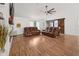Bright living room featuring modern decor, barn door accents, and hardwood flooring, creating a cozy atmosphere at 2251 Evenglow Ave, Spring Hill, FL 34609